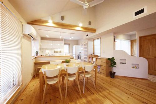 The dining room space is also open, and the long six-person dining table just fits the family of five.