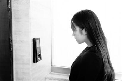 In a building in Beijing, employees are verifying their identity through Hanwang face recognition access control.