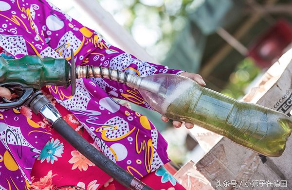 Gas station fuel injectors on the Mekong River directly poured into plastic bottles