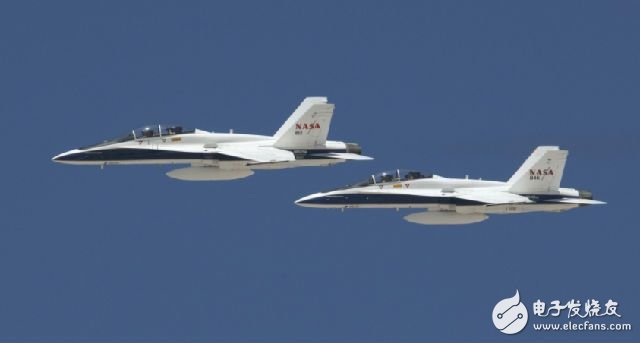 There is always a fighter jet next to the US space shuttle.