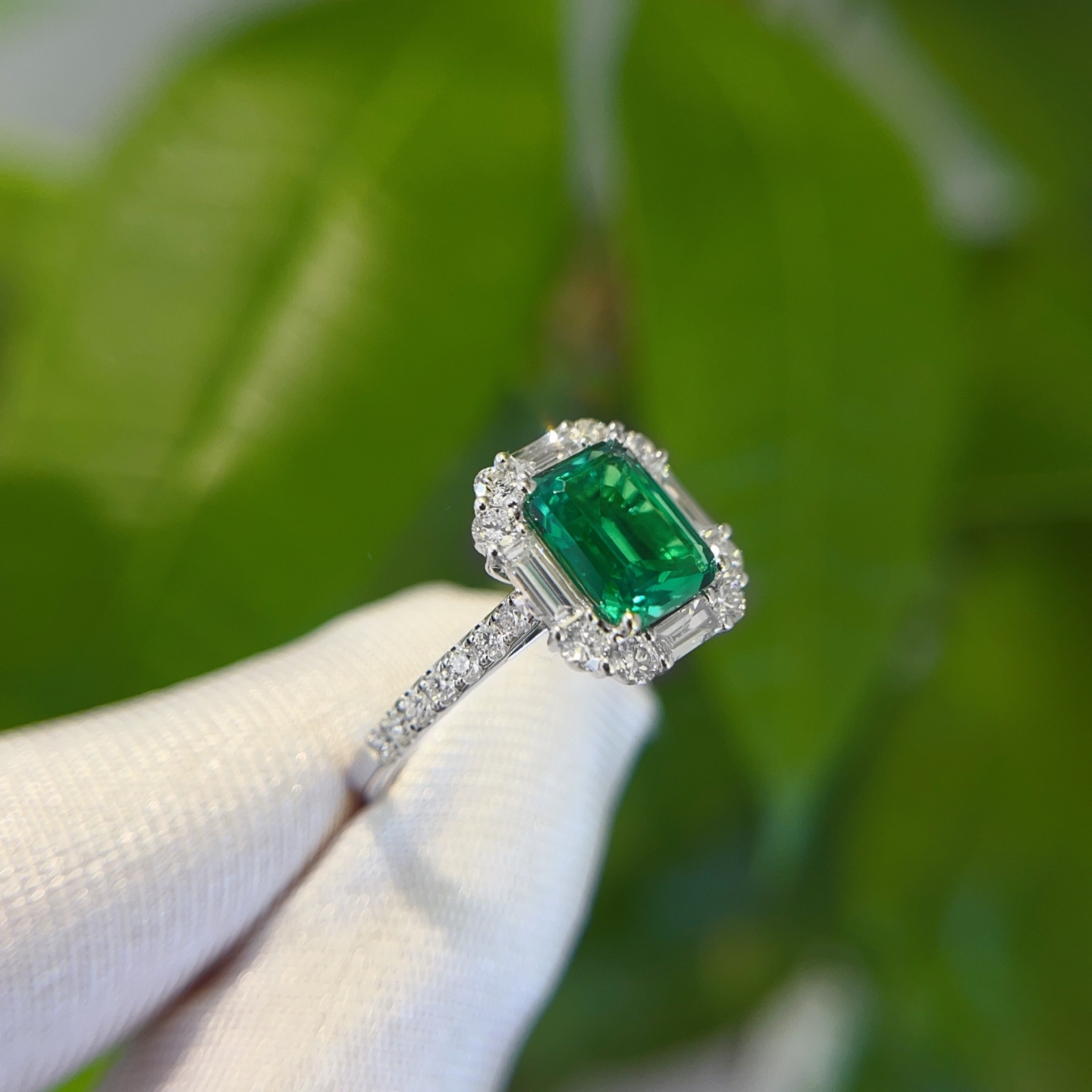 Angled View of Emerald Cut Lab Emerald Ring with Micro-Pavé Diamonds