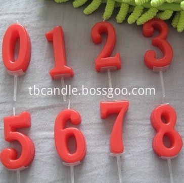 red number candle on stick