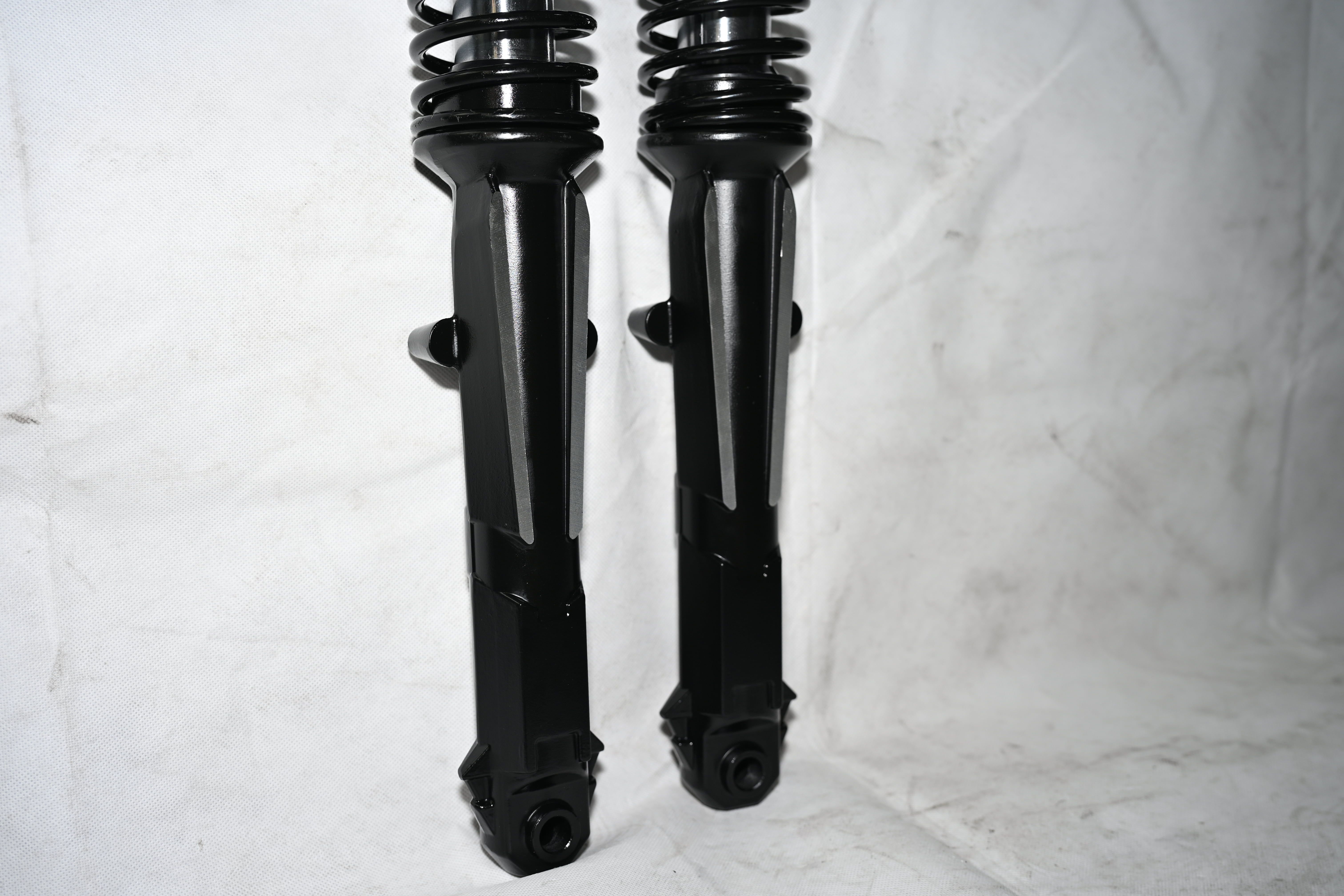 External spring tip shock absorber External spring tip shock absorber