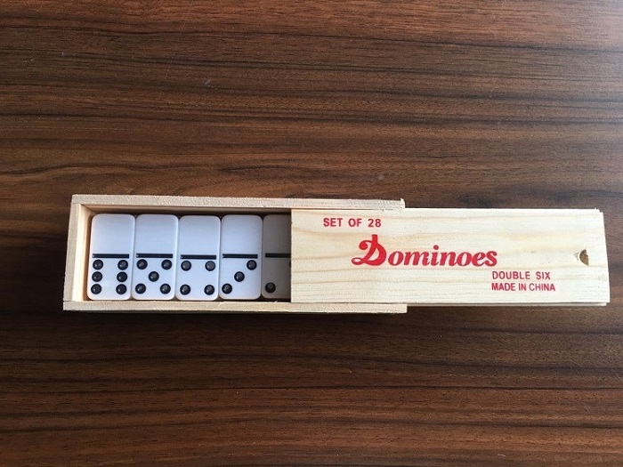 plastic dominos in wooden box