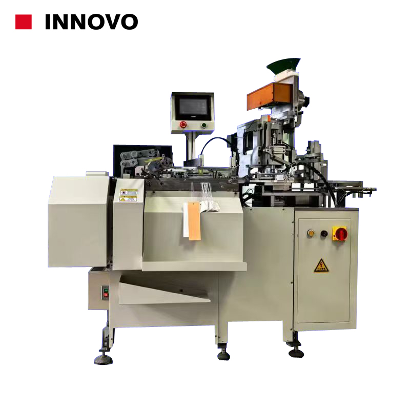 Automatic tags eyelet and threading machine Automatic tags eyelet and threading machine