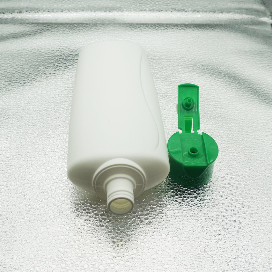 White Oval Bottle with Green Flip Cap for Cosmetic Packaging