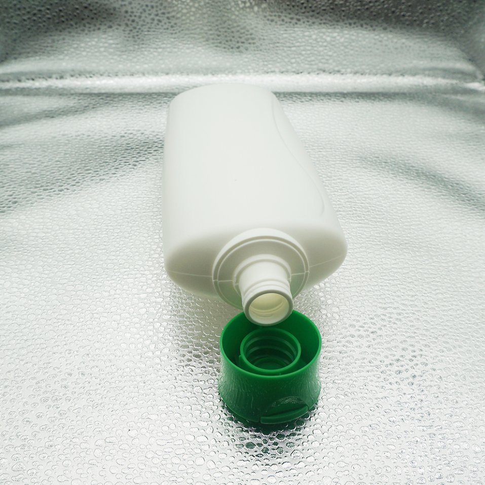 White Oval Bottle with Green Flip Cap for Cosmetic Packaging