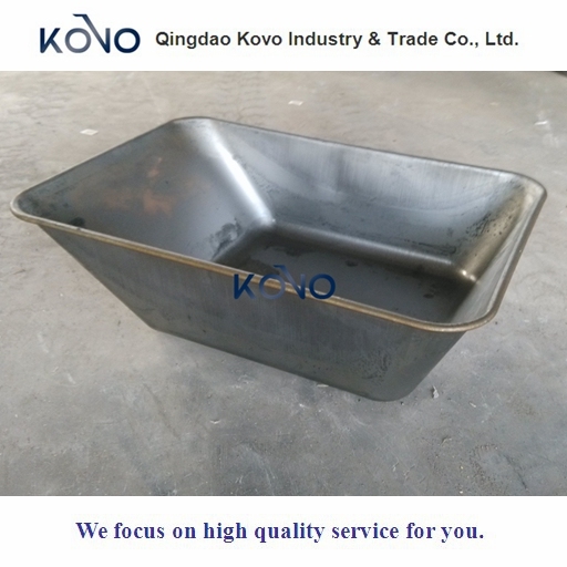 Wheelbarrow Tray for Guinea Loaded with Iron Pipes