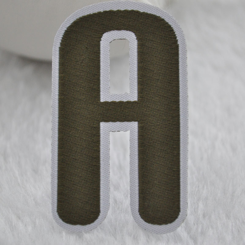 Letters of an Alphabet Woven Label with Laser Cutting for Shoes Labels