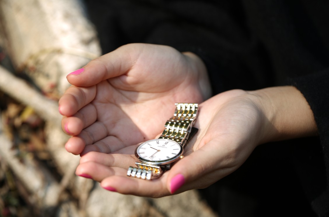 In the winter, lying in the grass on the park in the sun