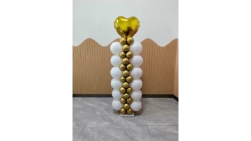white and gold balloon stand