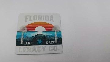Silver silicone label printed on woven layer