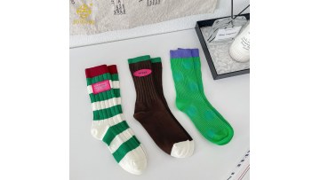 Korean version color blocking manual labeling mid tube socks for women