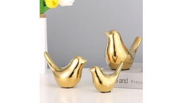 Small gold bird statue