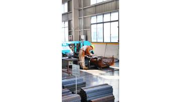 Technicians conduct on-site inspections and adjustments.