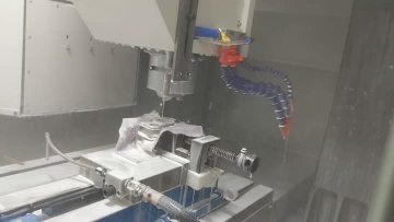 High-pressure water nozzles are used in conjunction with machine tool spindles for automated deburring of parts.