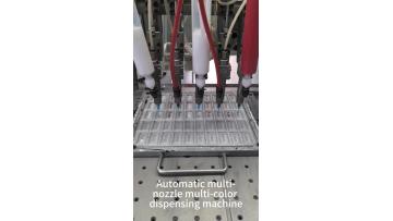 Multi-nozzles dispensing machine for logo labels