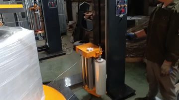 Pre-stretch pallet wrapper with top press