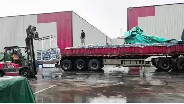 EPDM rubber granules are being loaded onto trucks for shipment
