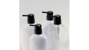 A shampoo bottle with a pump