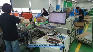 Laser printing of injection molded parts