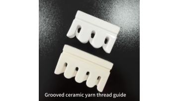 Grooved ceramic yarn thread guide