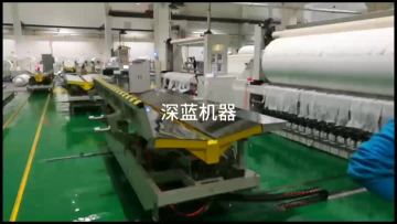 Nonwoven fabric wrapping machine
