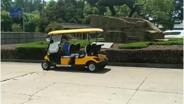 Yellow 6 seater electric golf cart driving video.mp4