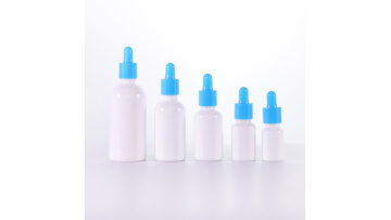Opal white glass bottle with blue dropper