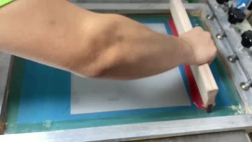 The screen printing of water based ink on glass