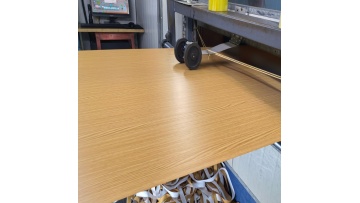 Uncoiling and leveling of wood-grain laminated metal coils