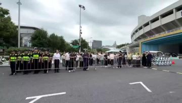 Firefighters make an appearance in the fire drill at Huanglong Sports Center