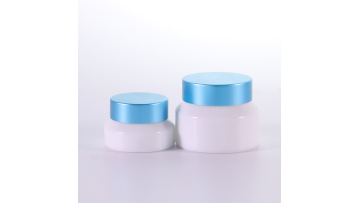 Opal white cream jar with blue cap