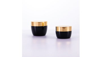 Black cream jar with golden lid