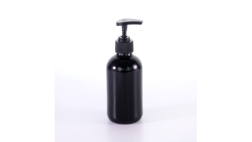  glass boston round bottles with black pumps