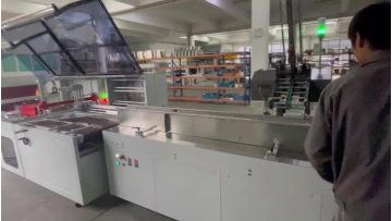 Pack books with card feeder and book separator