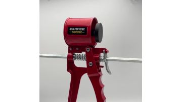 Red metal caulking gun