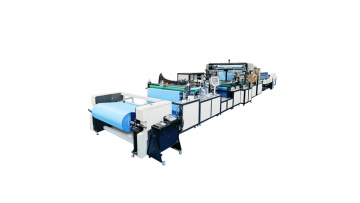 Disposable poncho making machine