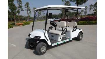 Workers are installing transparent rain curtains on 4 Seater Golf Cart.