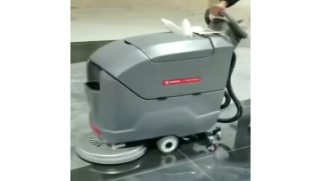 Cleaners are working with our motorized sweepers in the underground garage.