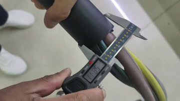 Cutting and stripping machine for large charge cable