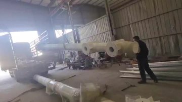 Large light pole being loaded