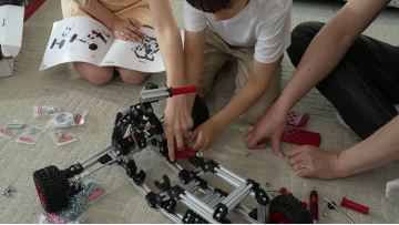 The parent - child time of assembling a go - kart together