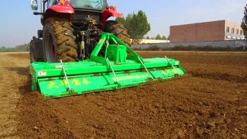 Soil covered trailer rotary tiller