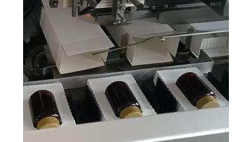 Bottle with tray cartoning machine