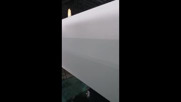 Workers inspect  machine