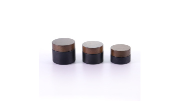 Black glass cream jar with ashtree wood lid