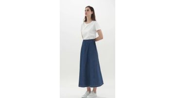 A one-piece denim skirt with straps. 