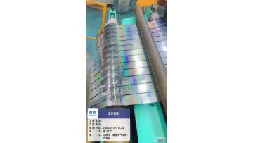 Slitting of tinplate coils laminated with specified exterior films