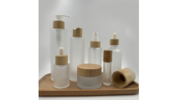 Hot Sale: Custom Frosted Glass Lotion Pumps with Bamboo Lids for Cosmetics (100ml-150ml)1